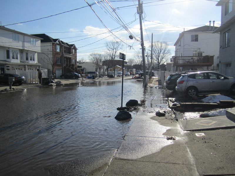 Flooding is common along parts of the coast even when a hurricane is not passing through. Above, a street in Midland Beach after snow melted last winter.