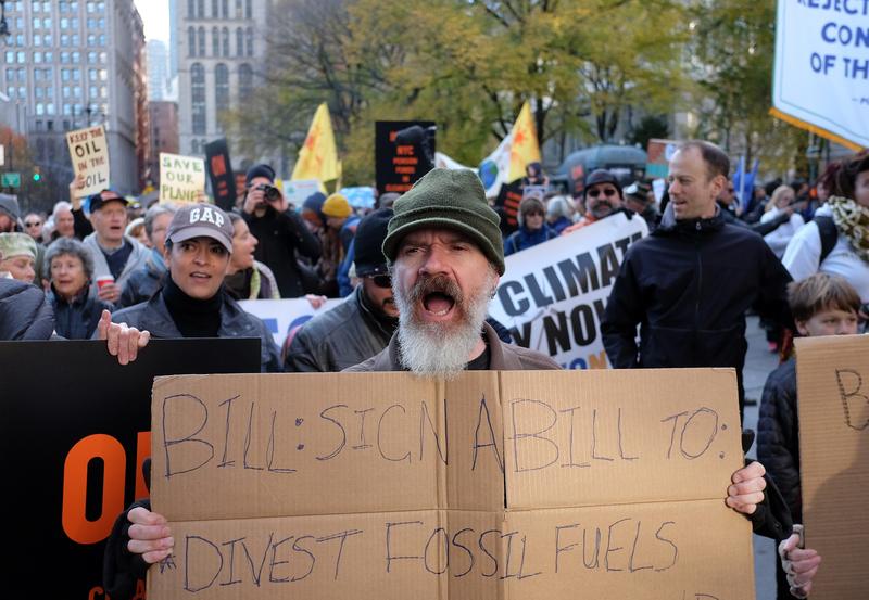 Environmental activists and supporters take part in a rally calling for action on climate change in New York on November 29, 2015, a day before the start of the COP21 conference in Paris.