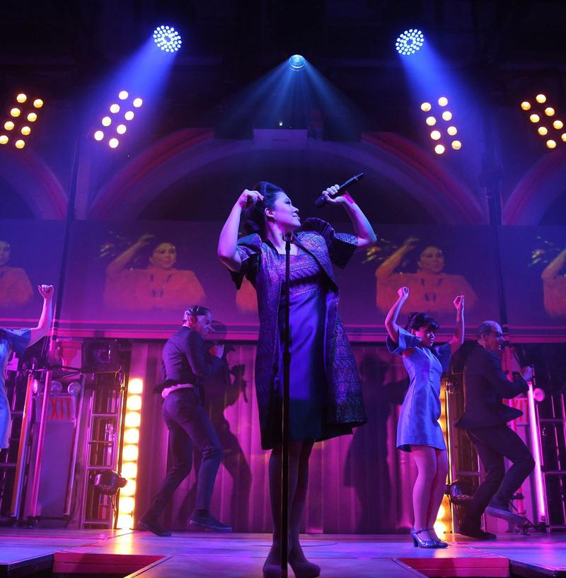 Ruthie Ann Miles (center) and the cast of <em>Here Lies Love</em>