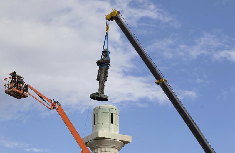 A statue of Confederate General Robert E. Lee is removed from Lee Circle Friday, May 19, 2017, in New Orleans.