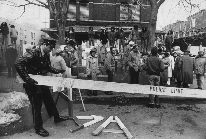MOVE members and police during the 1978 confrontation outside MOVE headquarters. "Let the Fire Burn," a film by Jason Osder. A Zeitgeist Films release.