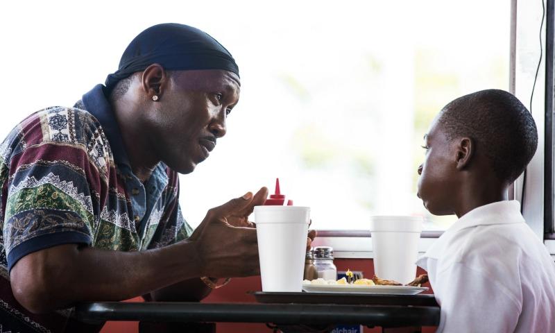 Mahershala Ali and Alex R. Hibbert in “Moonlight”