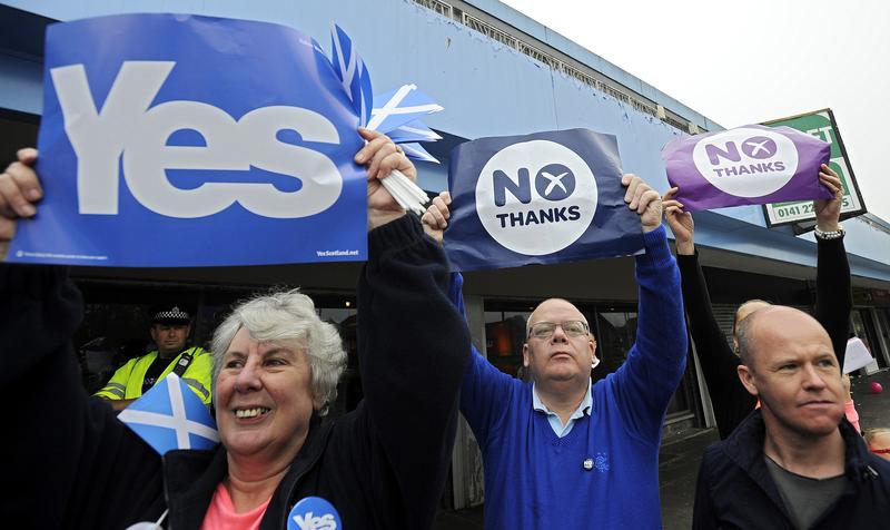 Pro-union (R) and pro-independence (L) campaigners jostle for space during a rally by Scotland's Deputy First Minister Nicola Sturgeon in Glasgow, Scotland, on Sept. 12, ahead of the referendum.