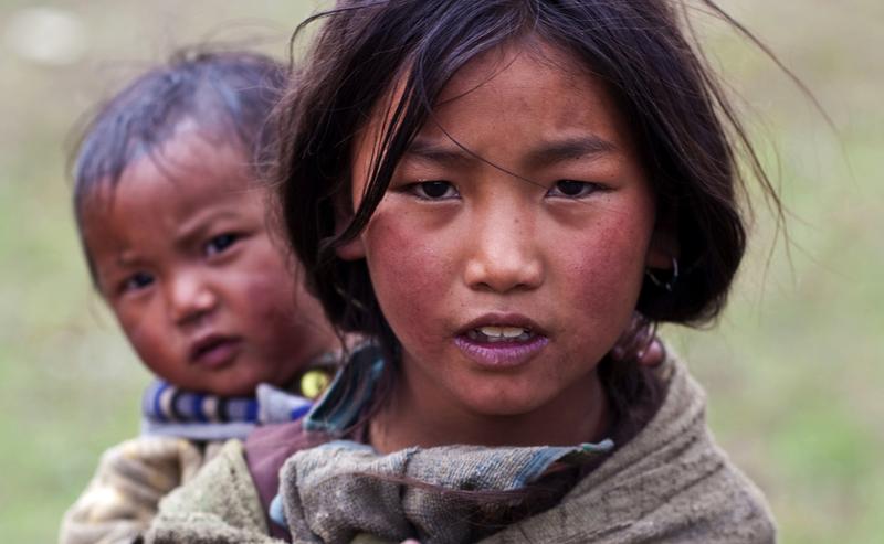 Tibetan girl Ningma Dolkar, 9, from the village of refugees poses for the photo during the Dho Tarap Full Moon Festival on September 10, 2011 in Dho Tarap, Upper Dolpo, Nepal