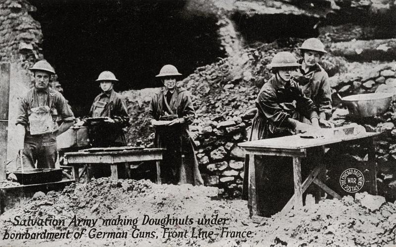 Salvation Army making Donuts - postcard depicting Salvation Army making donuts under bombardment of German guns while in front line in France during WWI, circa 1914-1918.
