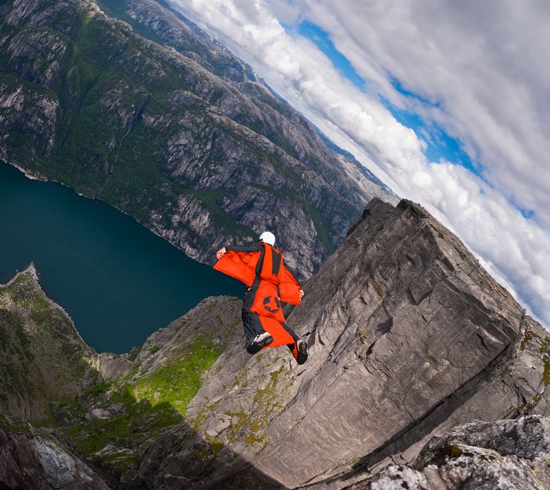 A B.A.S.E. jumper in wingsuit jumps off a cliff August 21, 2010, in Kjerag, Norway. Wingsuit cliff jumping is an advanced discipline, it makes human flight possible.
