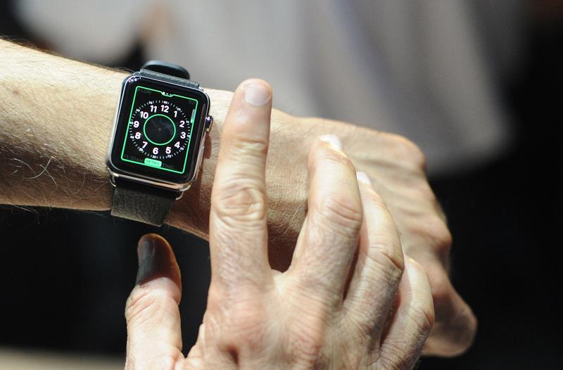 An Apple employee demonstrates how to use an Apple Watch during an Apple media event at the Yerba Buena Center for the Arts in San Francisco, California on March 09, 2015.