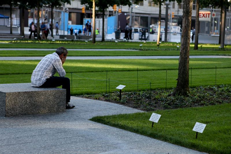 Visitors mourn at the 9/11 Memorial Plaza.