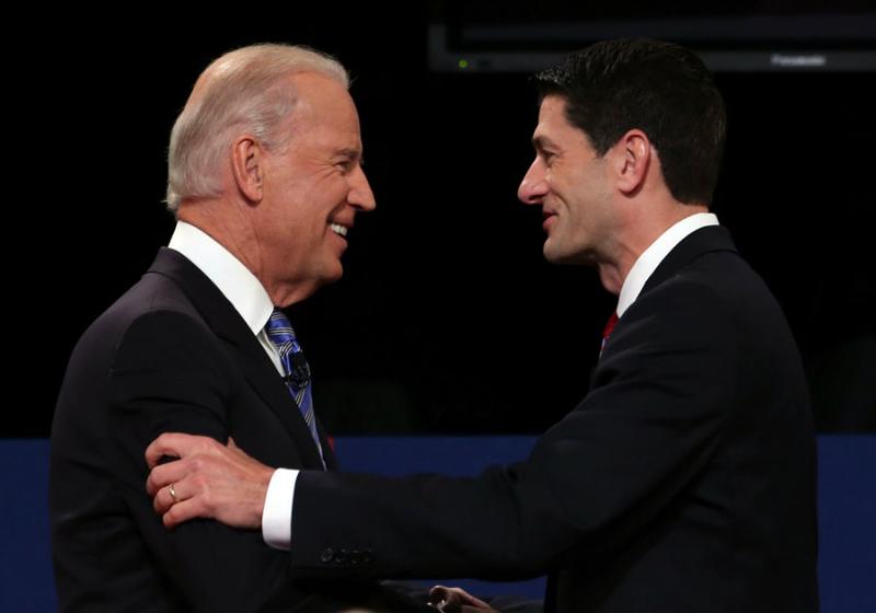 U.S. Vice President Joe Biden (L) shakes hands with Republican vice presidential candidate U.S. Rep. Paul Ryan (R-WI) (R) during the vice presidential debate.