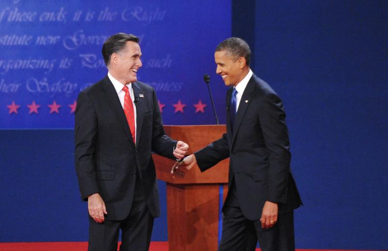 US President Barack Obama and Republican presidential candidate Mitt Romney share a laugh October 3, 2012 at the conclusion of the first presidential debate.