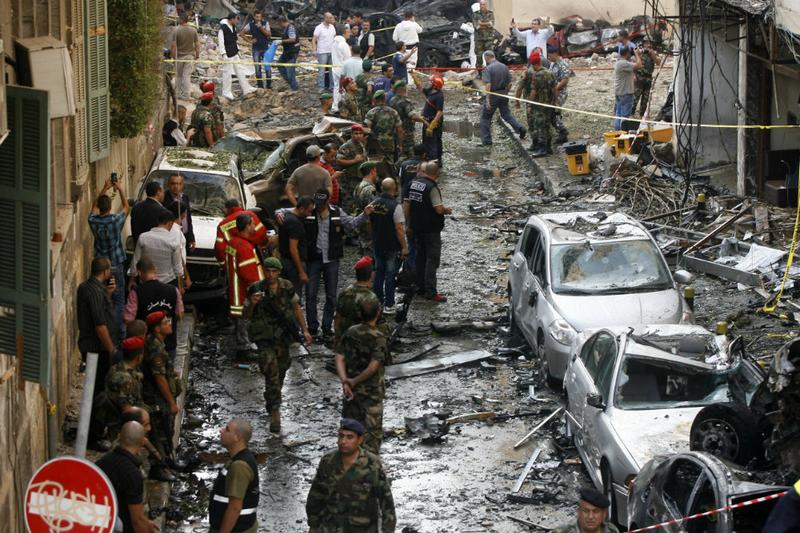 Lebanese security forces and rescue workers gather at the site of an explosion in Beirut's Christian neighbourhood of Ashrafieh on October 19, 2012.
