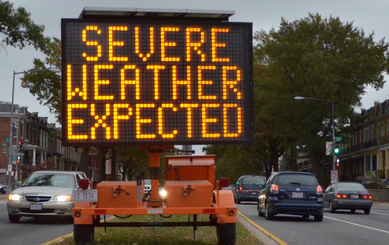 A road sign warns drivers of weather conditions in downtown Washington, DC October 28, 2012 ahead of Hurricane Sandy's landfall.