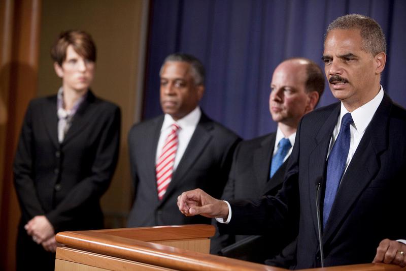 Laura E. Duffy (L), U.S. Attorney in California, B. Todd Jones (2L), U.S. Attorney for Minnesota, and David Kris (2R), listen as Attorney General Eric H. Holder Jr. speaks about terrorism arrests.