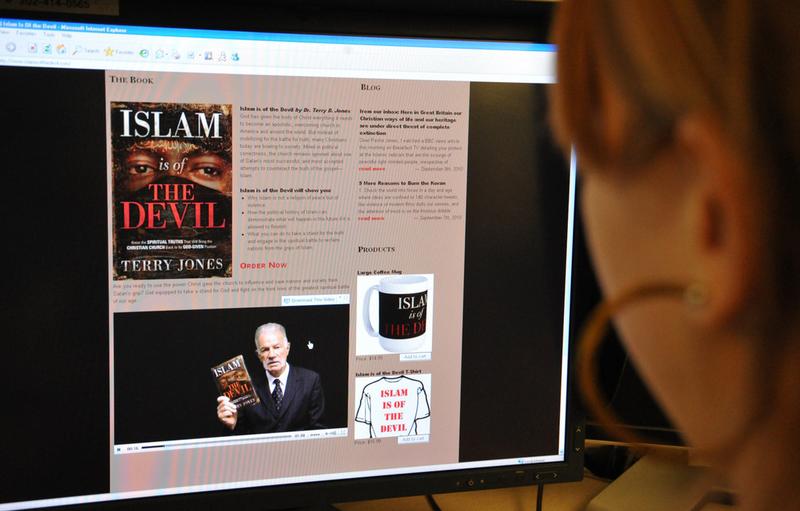 A journalist looks at the website 'Islam is of the Devil' featuring a book for sale written by Terry Jones, pastor of the Dove World Outreach Center, September 8, 2010