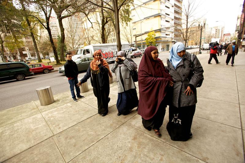 People walk past the media to enter the US Courthouse where suspected Portland car bomber Mohamed Osman Mohamud is having his first court appearance on November 29, 2010 in Portland, Oregon.