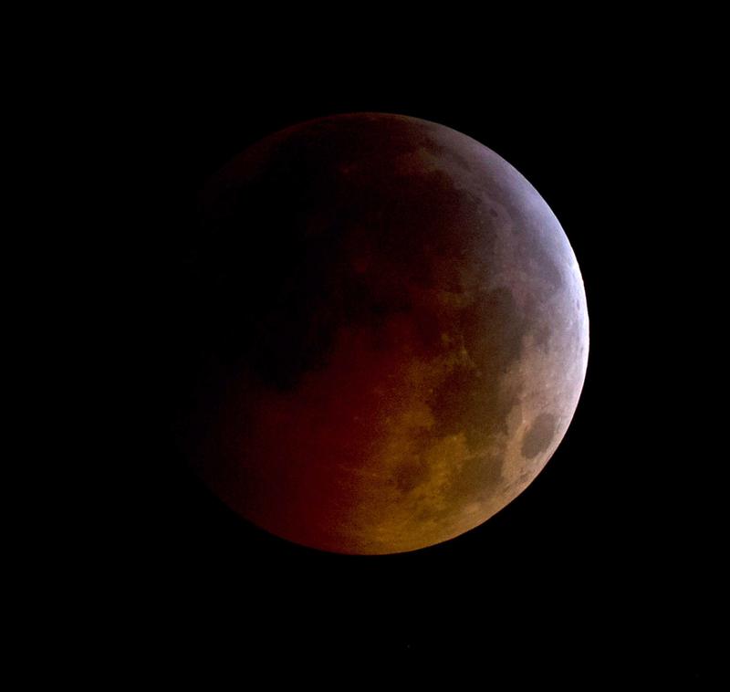 In this handout photo provided by NASA, A total lunar eclipse is seen as the full moon is shadowed by the Earth on the arrival of the winter solstice, on December 21, 2010 in Arlington, Virginia.