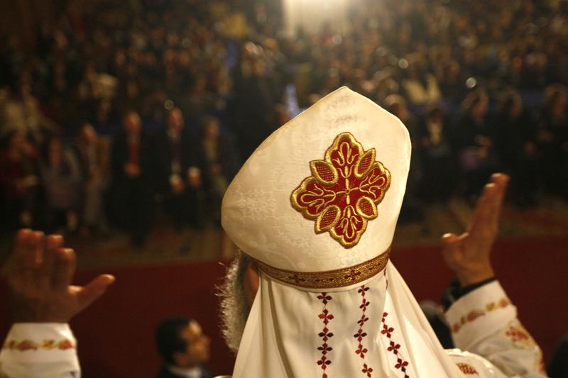 An Egyptian Coptic Christian translates into sign language during Christmas midnight mass at Abassiya Cathedral in Cairo on January 6, 2011.