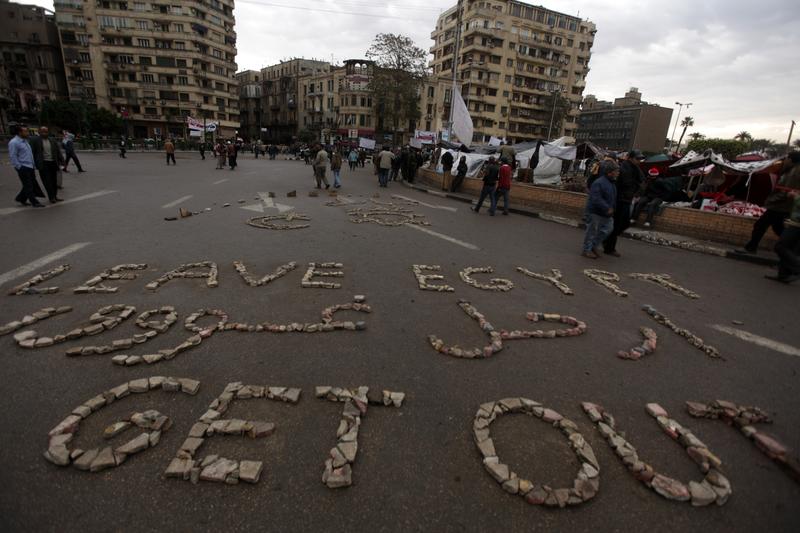 'Leave Egypt Get Out' is written out with stones by Egyptian anti-government protesters in Cairo's Tahrir Square on February 06, 2011.