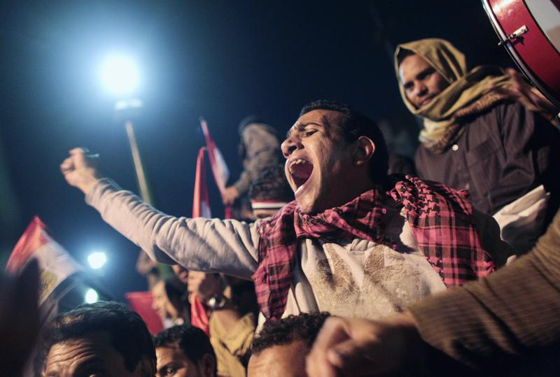 Anti-government protester cheers as news of the possible resignation of Egyptian President Hosni Mubarak seeped into Tahrir Square February 10, 2011 in Cairo, Egypt.