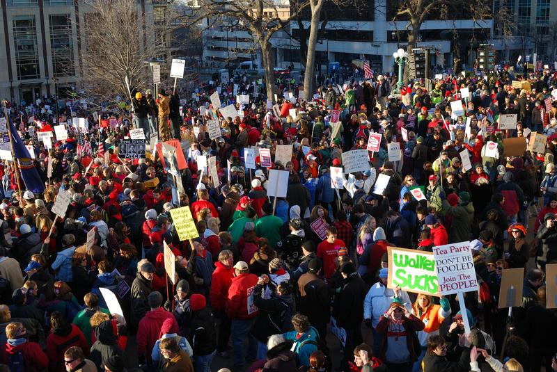 Protesters seen February 19, 2011 in the fifth day of mass demonstrations against a Republican plan to bust public workers unions. A similar fight is brewing in Ohio.