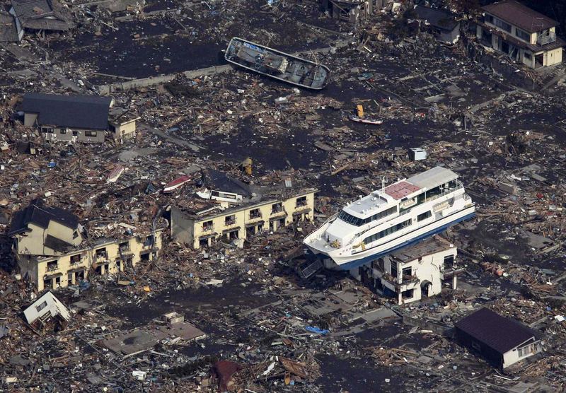 This aerial shot shows a pleasure boat sitting on top of a building amid a sea of debris in Otsuchi town in Iwate prefecture on March 14, 2011 following the March 11 tsunami.