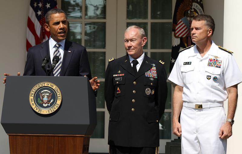 President Barack Obama speaks as Army Chief of Staff Gen. Martin Dempsey, and Navy Admiral James 'Sandy' Winnefeld listen during an event of Department of Defense personnel announcements.
