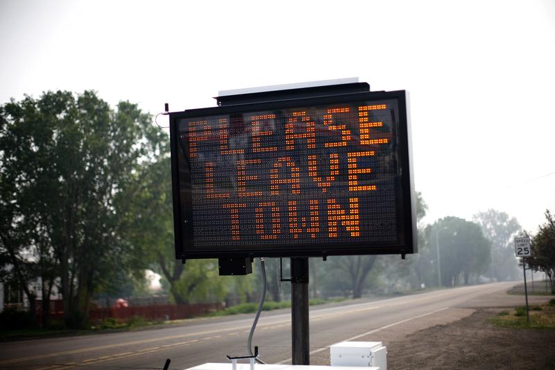 An evacuation asks residents to leave June 9, 2011 in Eagar, Arizona. Hundreds of thousands of acres continue to burn in eastern Arizona prompting evacuations by residents of Springerville and Eagar.