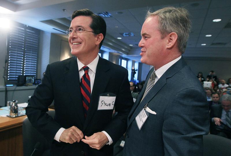 Stephen Colbert (L) stands with his attorney Trevor Potter during an appearance before the FEC to ask for a media exemption to create a political action committee on June 30, 2011 in Washington, DC.