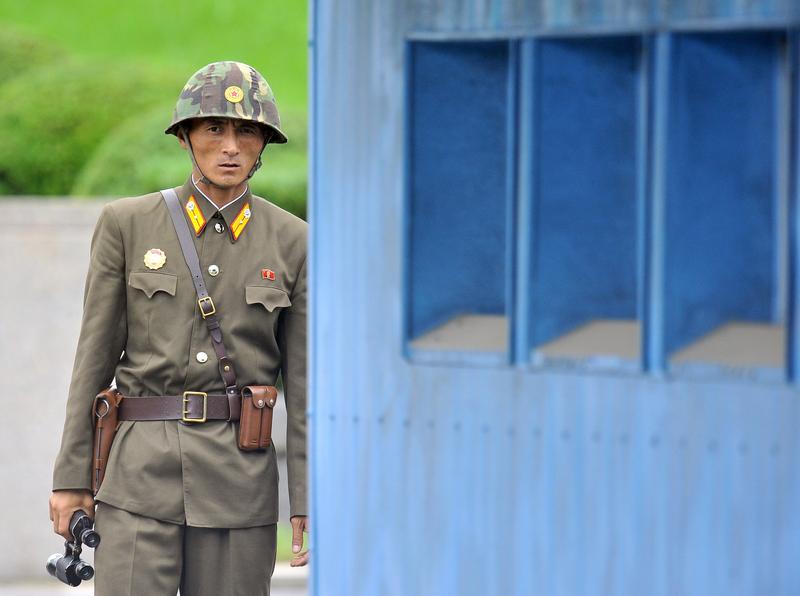 A North Korean soldier looks at the South side.