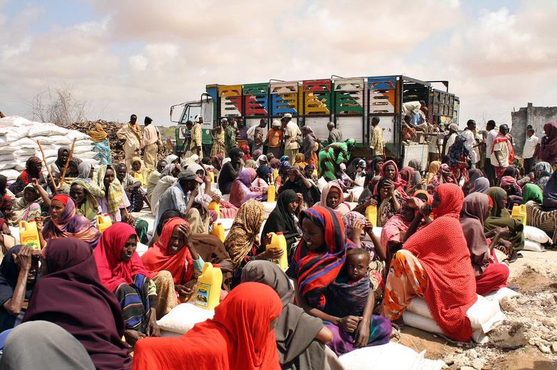 Displaced Somali families receive food-aid July 25, 2011 at an Internally Displaced Person (IDP) camp in Mogadishu.