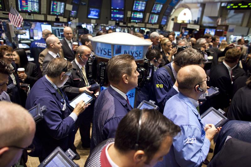 Traders work on the floor of the New York Stock Exchange.