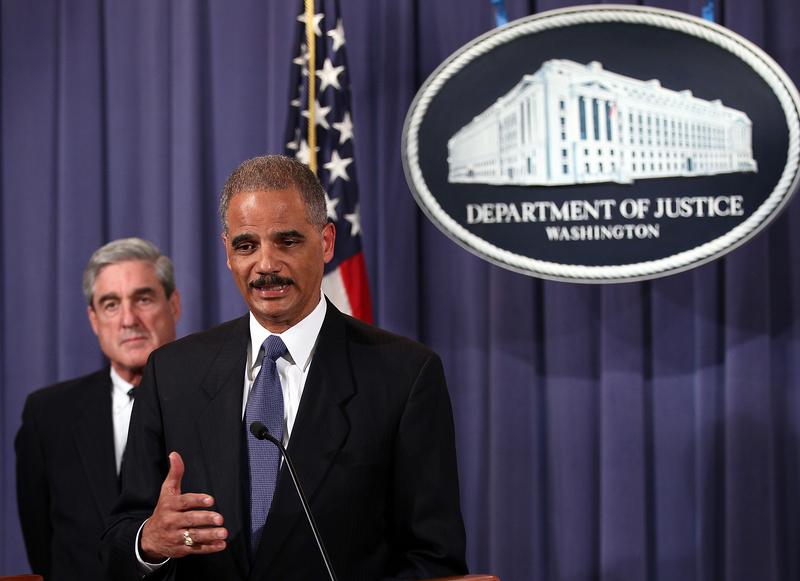 Attorney General Eric Holder (R) and FBI Director Robert Mueller (L) announce a plot was foiled involving men allegedly linked to the Iranian government to kill the Saudi ambassador to the U.S.