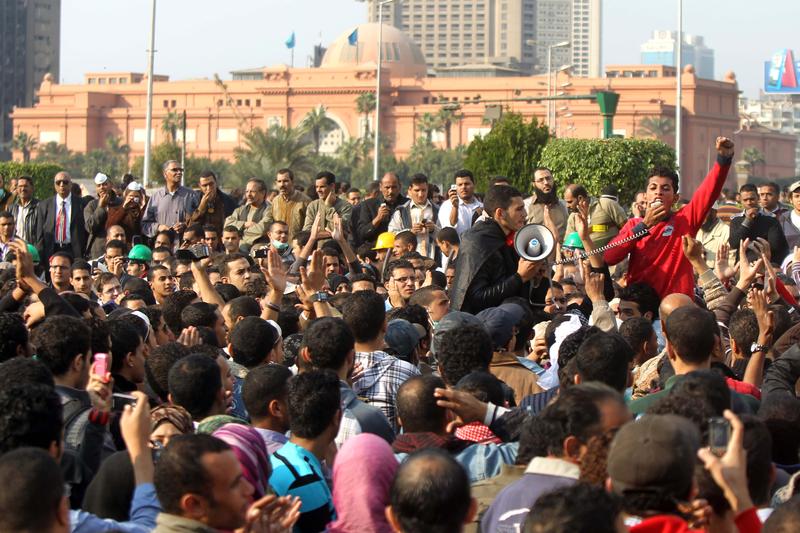 Egyptians protesters shout slogans against military ruler council during clashes on the third day with security forces at Tahrir Square in Cairo on November 21, 2011.