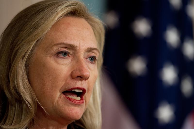 Hillary Clinton delivers remarks with U.S. Secretary of Treasury Tim Geithner.