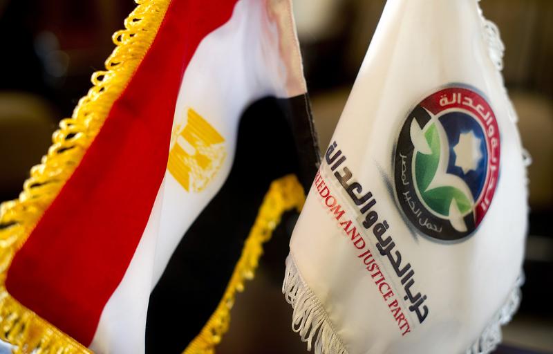 An Egyptian flag is placed next to the flag of the Freedom and Justice Party at the party headquarters in Cairo on November 30, 2011.