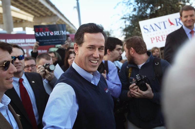 Republican presidential hopeful Rick Santorum arrives for a press conference on January 19, 2012 in Mt. Pleasant, South Carolina. According to certified results released, he won the Iowa caucus.