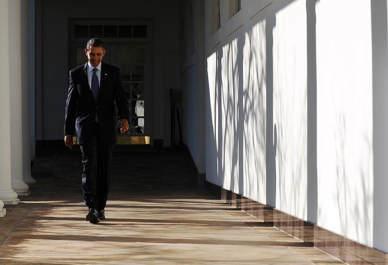 US President Barack Obama walks along the colonnade at the White House in Washington, DC, on January 24, 2012.