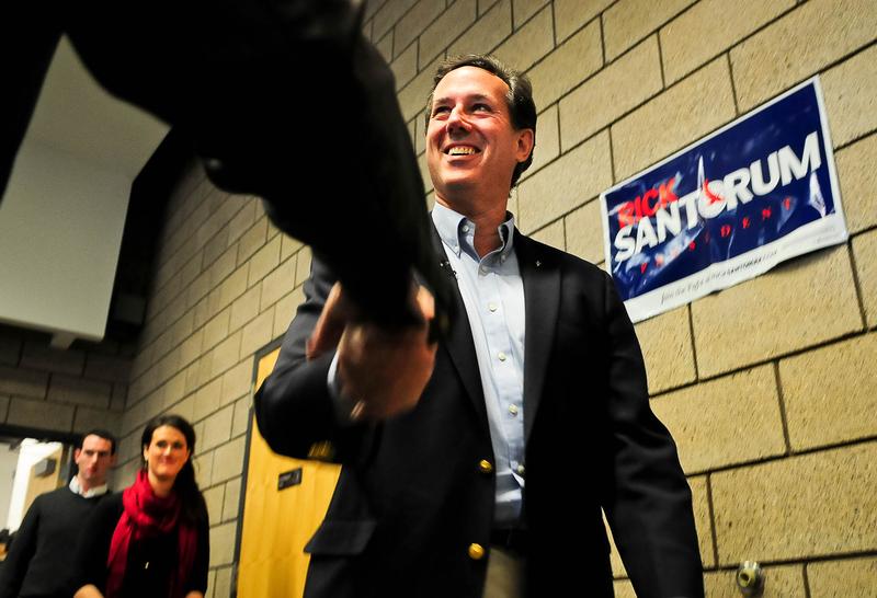Republican presidential candidate, former U.S. Sen. Rick Santorum autographs a sign after speaking at a campaign rally February 7, 2012 in Blaine, Minnesota.
