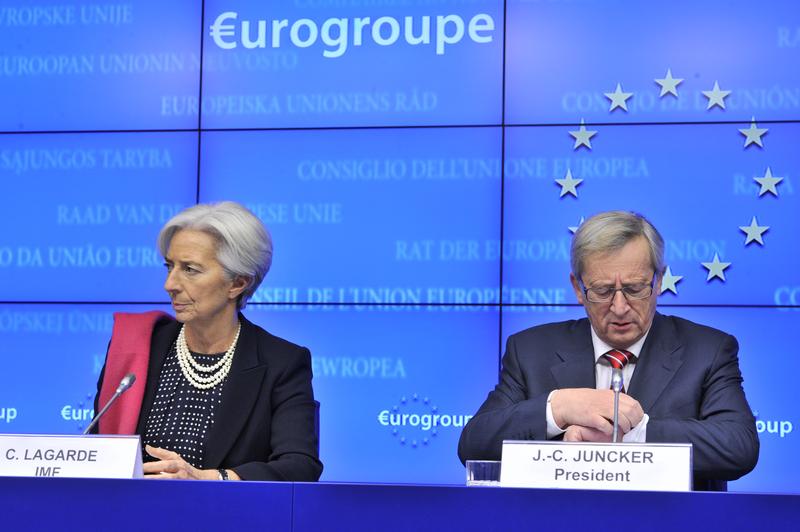 International Monetary Fund Managing Director Christine Lagarde (L) and Eurogroup president Jean-Claude Juncker give a press conference following an Eurozone meeting on February 21, 2012.