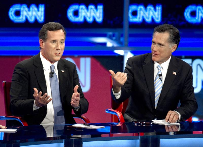 Rick Santorum and Mitt Romney debate on February 22, 2012 in Mesa, Arizona.
