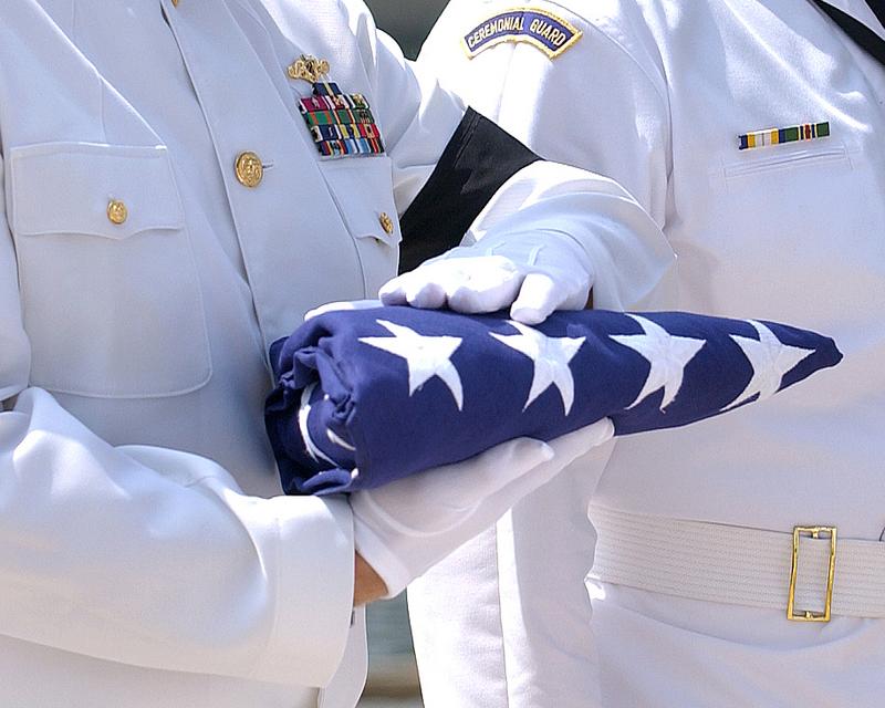 An American flag is prepared for presentation to the next of kin