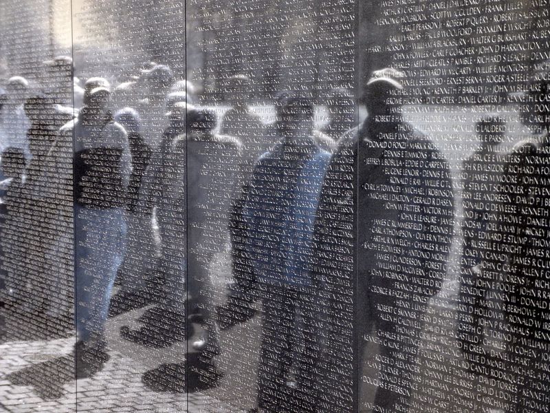 Veterans reflected in the Vietnam War Memorial