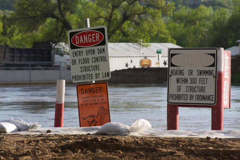 Flood warning signs near levees in Minot, North Dakota.