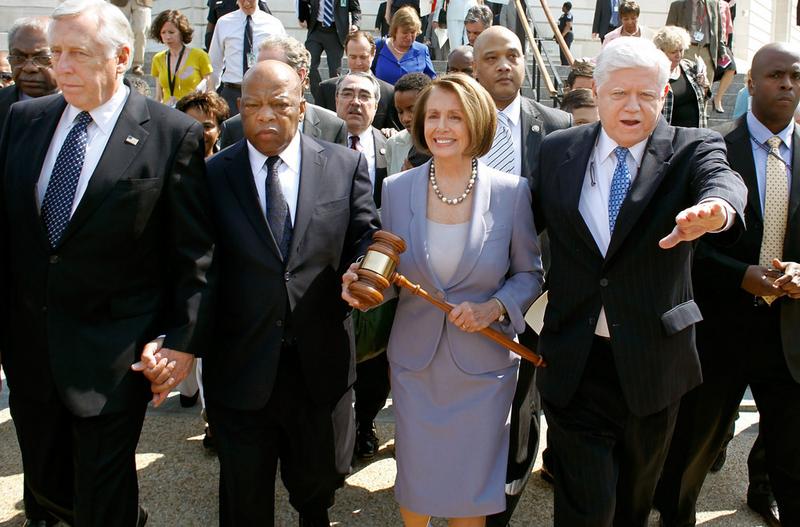 March 21: Speaker of the House Rep. Nancy Pelosi (D-CA) carries the gavel that was used when Medicare was passed by the House in the 1960s.