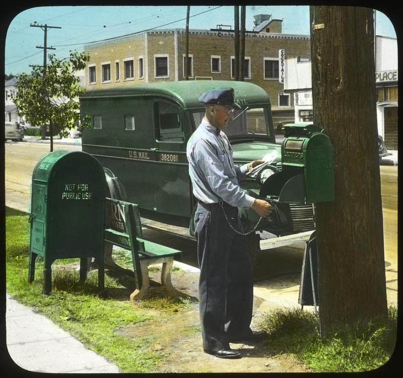 Letter carrier collecting mail, 1947.