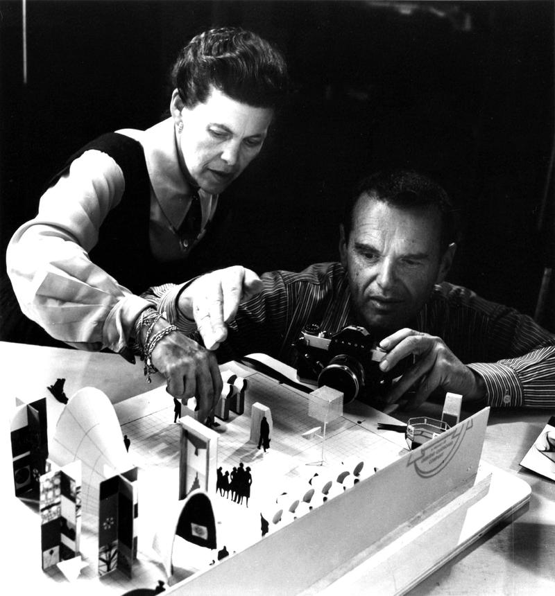 Ray and Charles Eames photographing an early model of the exhibition "Mathematica: A World of Numbers...and Beyond, 1960