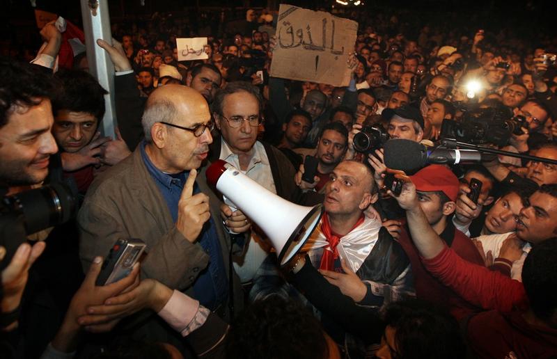 Opposition leader Mohamed ElBaradei waves to supporters in Tahrir Square on January 30, 2011 in Cairo, Egypt.