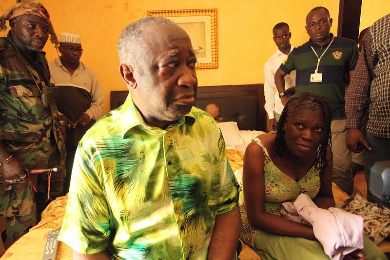 Ivory Coast strongman Laurent Gbagbo and his wife Simone sit on a bed at the Hotel du Golf in Abidjan after their arrest on April 11, 2011