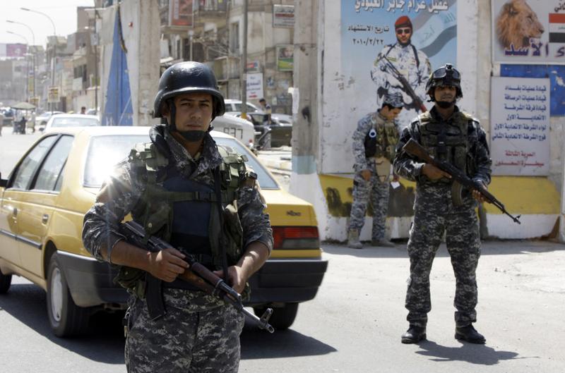 Iraqi soldiers man a checkpoint in Baghdad on August 19, 2010 after the last US combat brigade pulled out of Iraq.