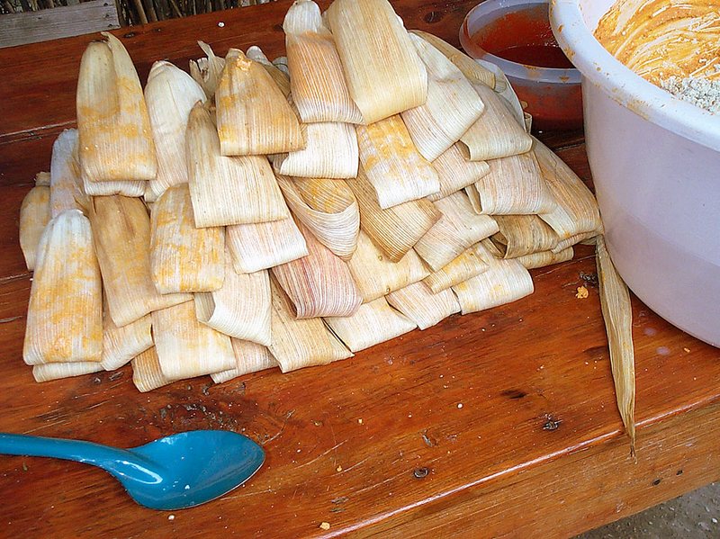 Tamales in corn husks.